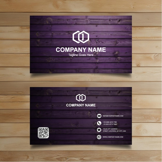 two business cards on a wooden wall with a purple background