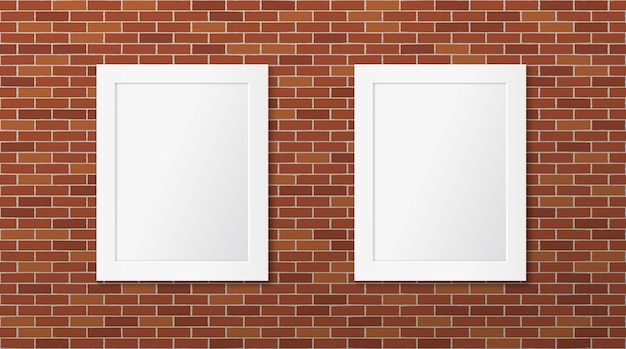 Two white frames on a brick wall Pictures layout