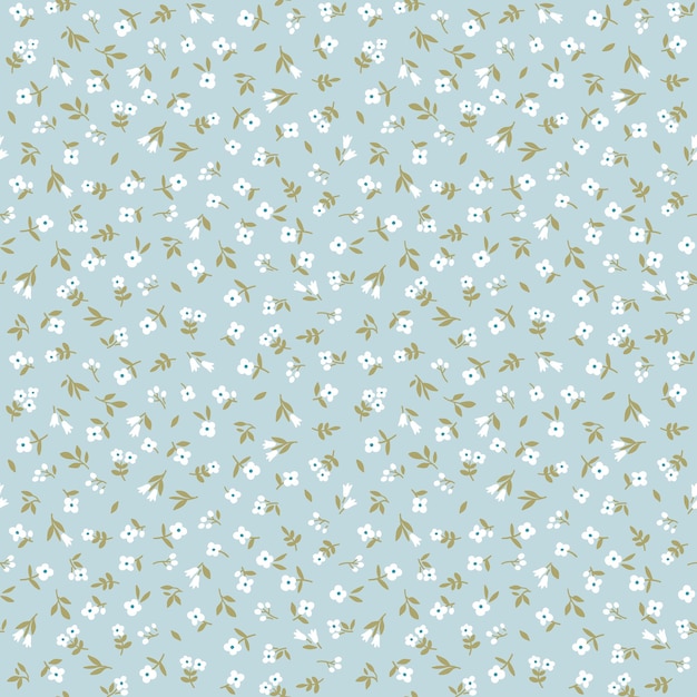 Vintage floral background Seamless vector pattern with small white flowers on a blue background