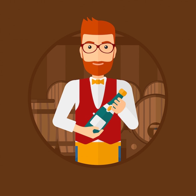 Waiter holding bottle in wine cellar.