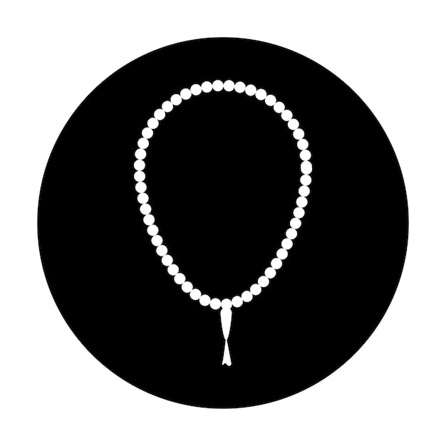 A white and black round pendant with a white bead on a black background