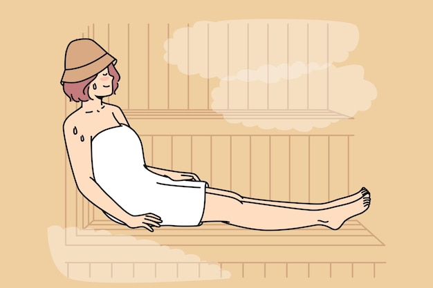 Woman in body towel sits sweating on bench in sauna