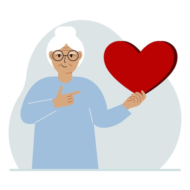 A woman holds a big red heart in his hand The concept of volunteering romantic relationship or love