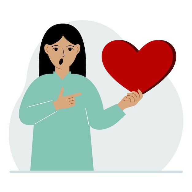 A woman holds a big red heart in his hand The concept of volunteering romantic relationship or love