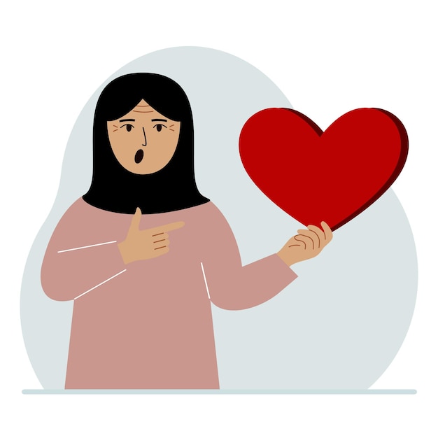 A woman holds a big red heart in his hand The concept of volunteering romantic relationship or love