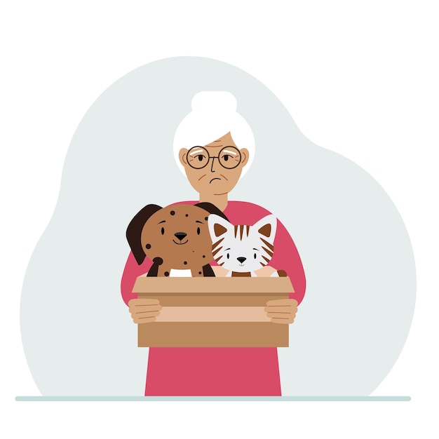 A woman holds a cardboard box with a cat and a dog The concept of rescue help and care for pets