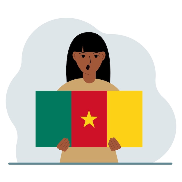 A woman holds the flag of Cameroon in his hands The concept of demonstration national holiday or patriotism Nationality