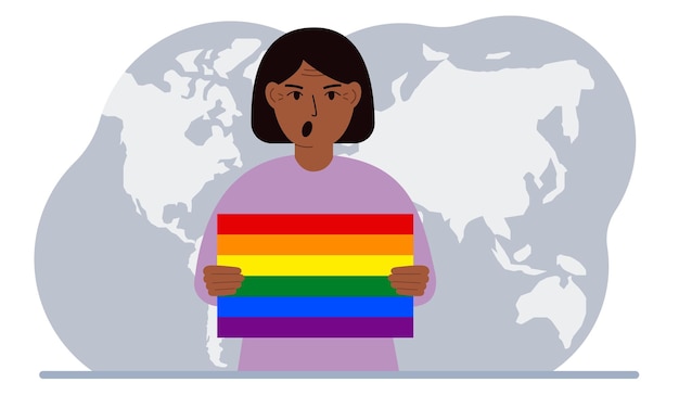 A woman holds an lgbt flag in his hands against the backdrop of a world map