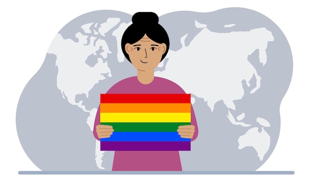 A woman holds an lgbt flag in his hands against the backdrop of a world map