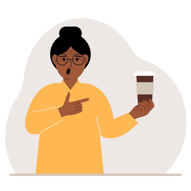 A woman holds a paper cup with coffee