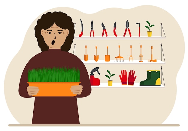 A woman holds a plant in his hands against the background of gardening tools Gardening concept