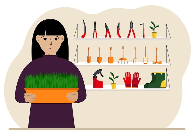 A woman holds a plant in his hands against the background of gardening tools Gardening concept