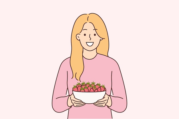 Woman holds plate of strawberries and smiles offers to try fresh berries and farm fruits Girl with smile looks at screen recommending eating organic strawberries containing antioxidants