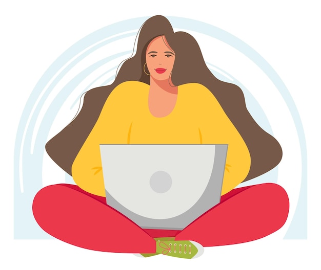 A woman is sitting in a lotus position and working on a laptop