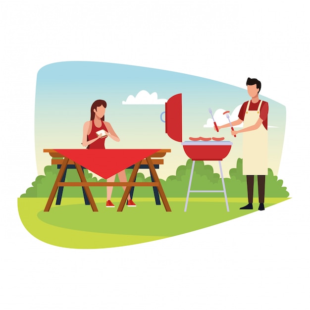 Woman and man in a picnic and bbq