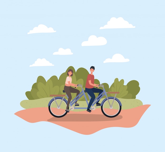 Woman and man riding bike at park