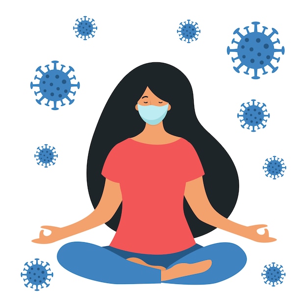 A woman practices yoga with a medical mask on her face. Coronavirus protection. Home quarantine.