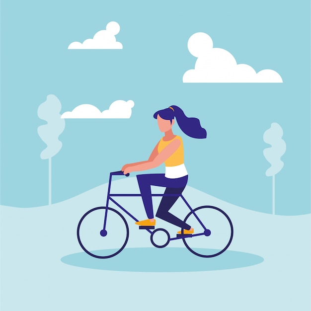 Woman practicing cycling in landscape