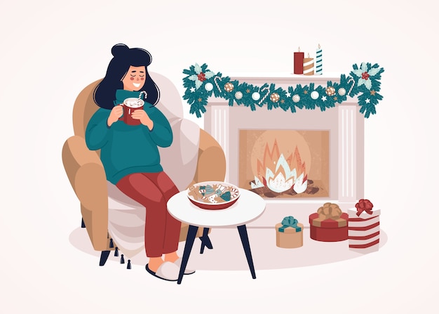 Woman sitting on a chair with a cup by the fireplace and gift boxes