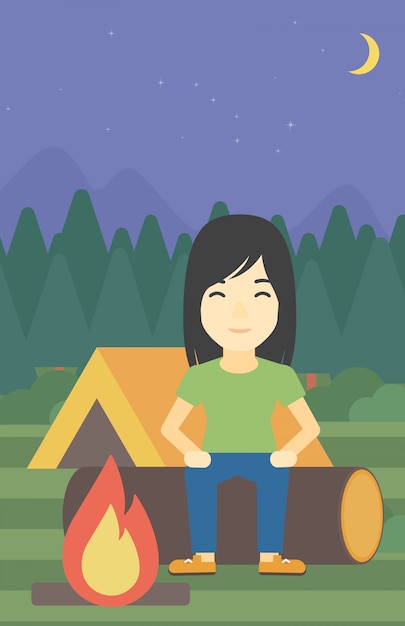 Woman sitting on log in the camping.