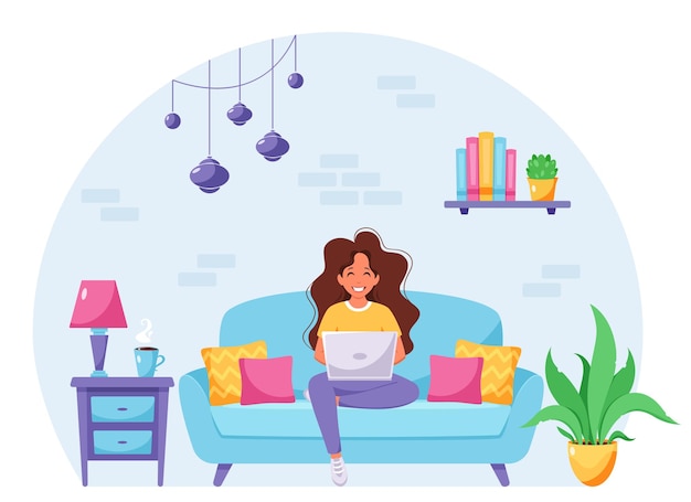 Woman sitting on a sofa and working on laptop Freelancer home office