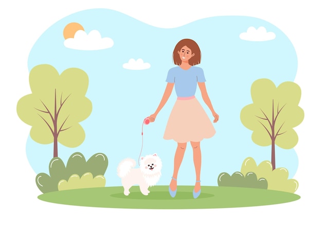 Woman walking with a white spitz dog in a park Outdoor activity love pets concept