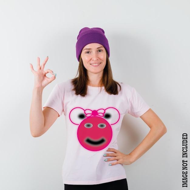 a woman wearing a purple hat with a pink bear on it