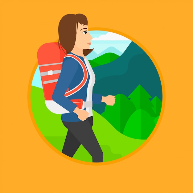 Woman with backpack hiking.