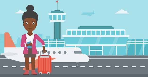 Woman with suitcase and ticket at the airport.