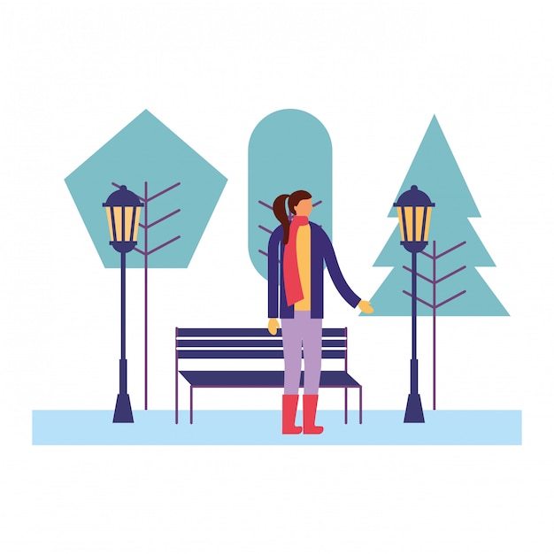 Woman with winter clothes in the park