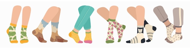 Women and men legs wearing fashionable socks with colorful sock with trendy pattern set