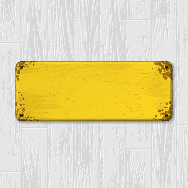 Yellow nameplate on wood