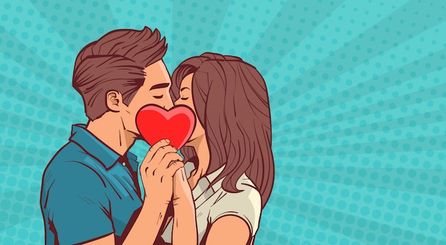 Young Couple Kissing Holding Red Heart Shape Over Retro Pop Art