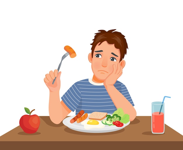 Young man has no appetite to eat food sitting in front of breakfast at table