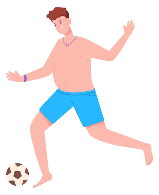 Young man in shorts kicking soccer ball