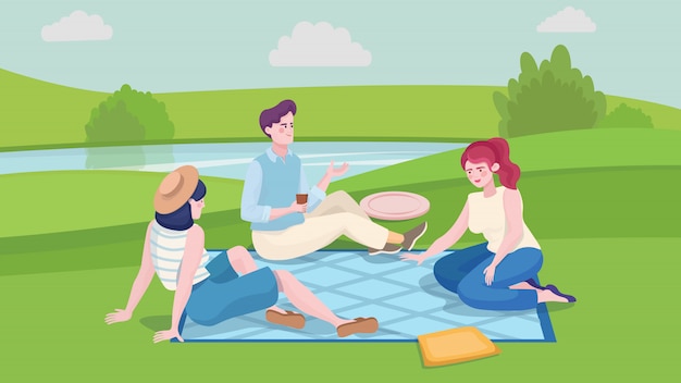 Young man and two girls at summer picnic