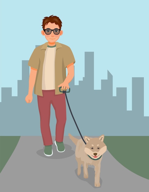 Young man walking dog in the park