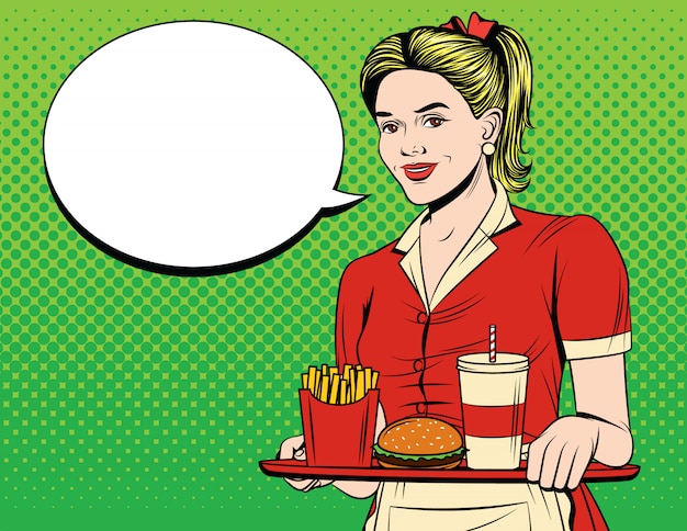 Young smiling girl in apron and american junk food serving an order