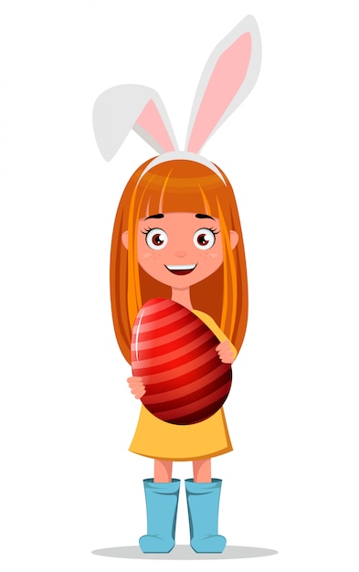 Young smiling redhead girl wearing bunny ears