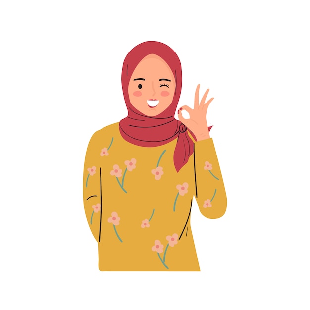 Young woman winking, smiling, and making OK sign with hand gesture.  Pretty lady wear hijab.