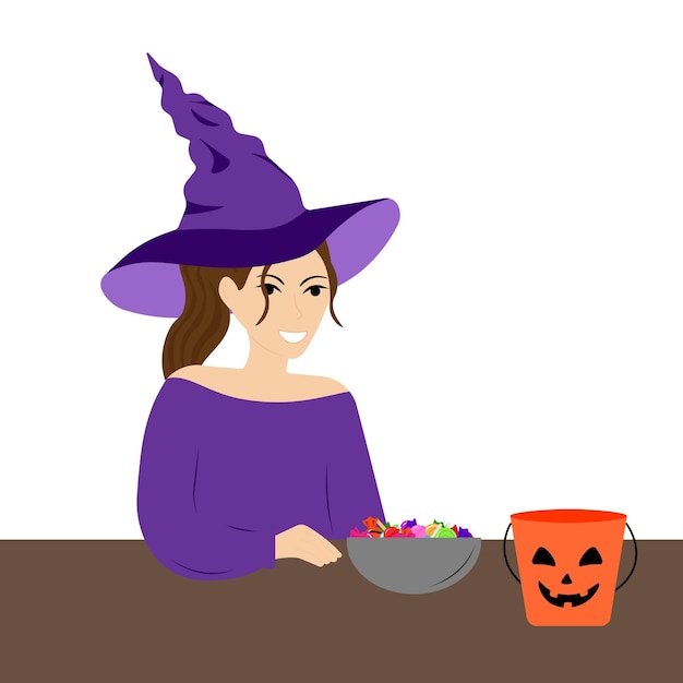 A young woman in a witch costume puts candy from a Halloween bucket into a bowl