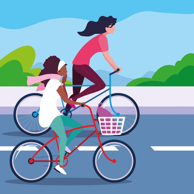 Young women riding bike in the road