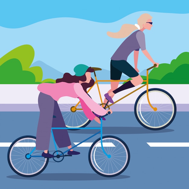 Young women riding bike in the road